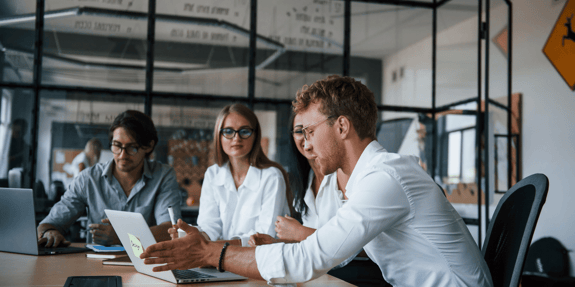 three people working in the office